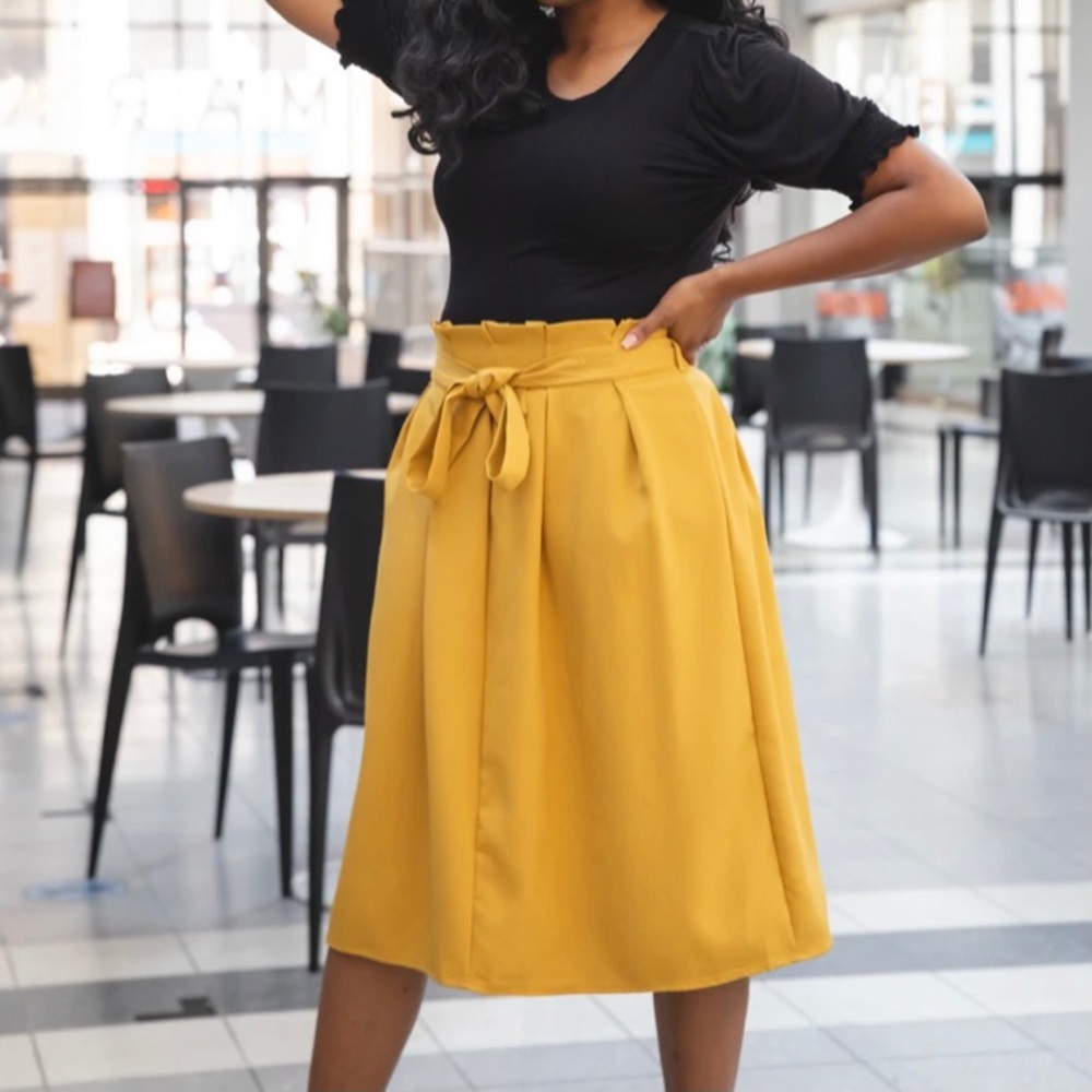 Our Mrs. Missy Mustard Yellow Skirt is definitely a statement piece.